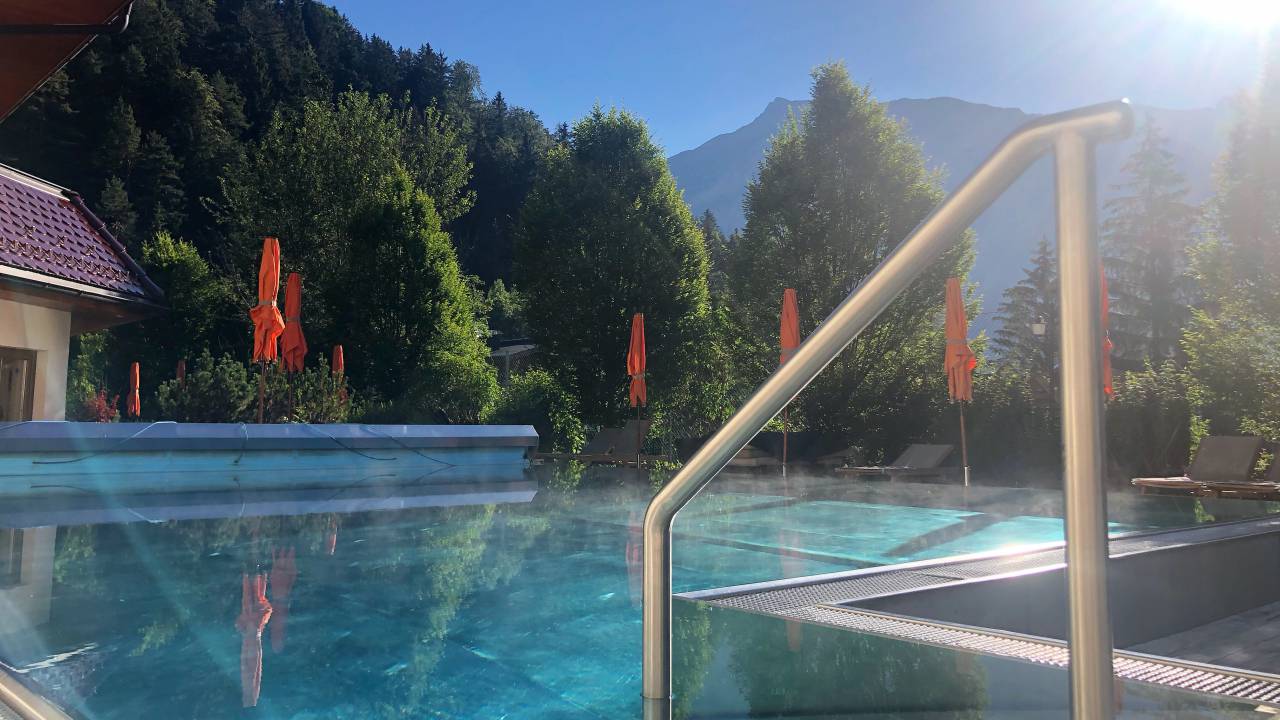 Swimming in the outdoor pool - spa hotel Kristall at lake achensee